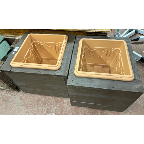 21 - PAIR OF HAND CRAFTED WOODEN GARDEN PLANTERS WITH PLASTIC PLANTER INSERTS