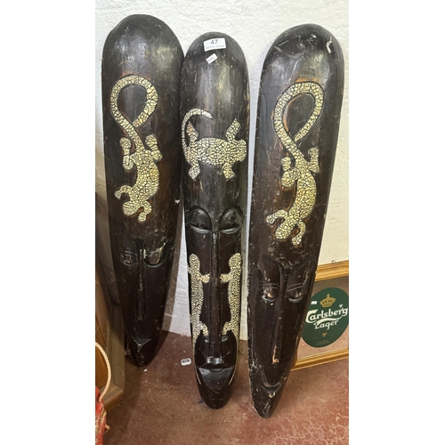 47 - 3 TALL CARVED AFRICAN WALL MASKS