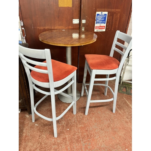 9 - TALL METAL BASE WOODEN CIRCULAR TOP TABLE & PAIR OF BAR STOOL/CHAIRS