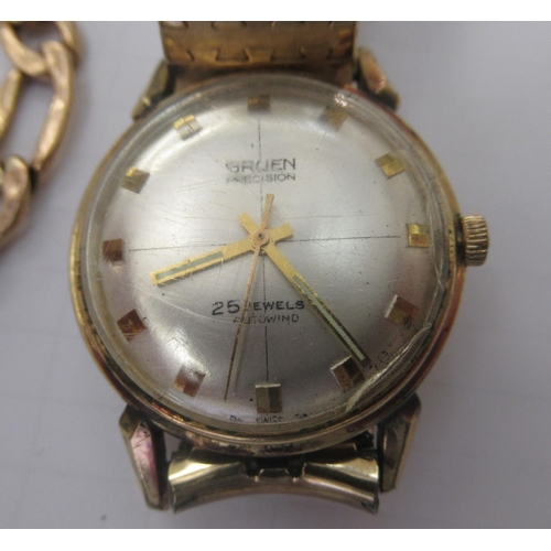 159 - A yellow metal curb link bracelet&nbsp; stamped 10k; and a Gruen gold plated manual wristwatch, face... 