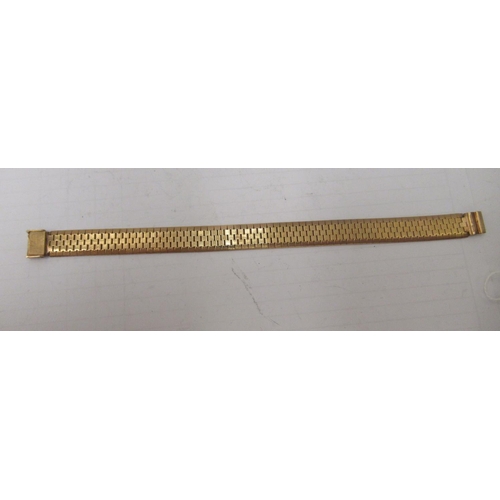 133 - A 9ct gold brick link bracelet