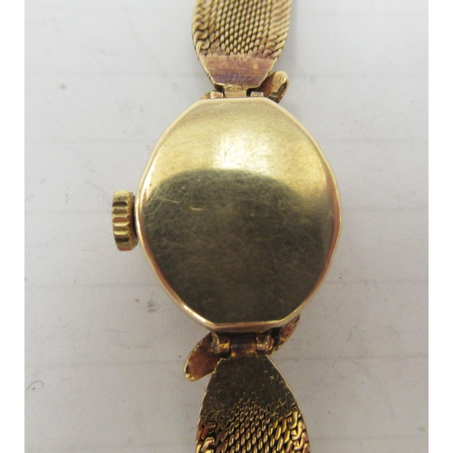 134 - A lady's 9ct gold cased bracelet watch, faced by a baton dial 