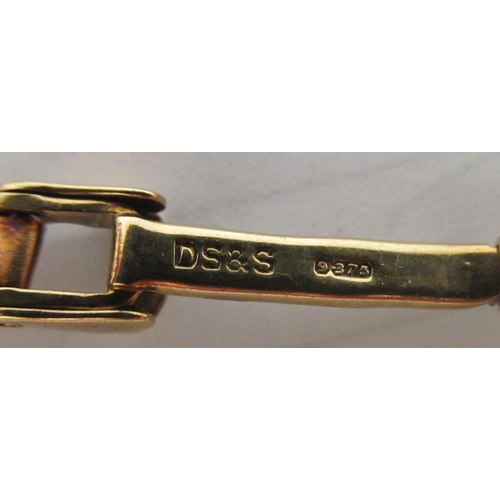 134 - A lady's 9ct gold cased bracelet watch, faced by a baton dial 