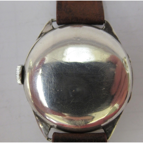 326 - An Omega, silver cased wristwatch, faced by an Arabic dial with subsidiary seconds, on a later brown... 