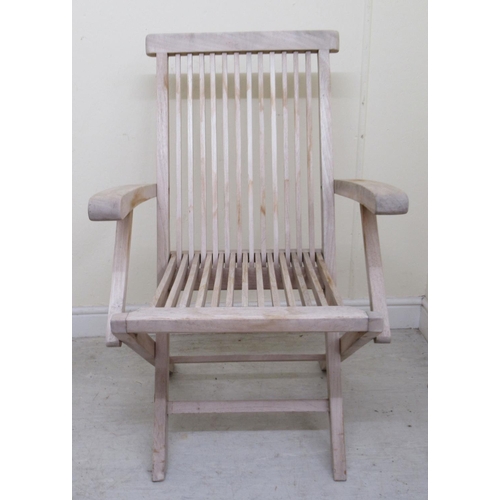 336 - A modern Lindsey teak garden table with a slatted octagonal top, raised on folding legs  30