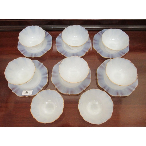 51 - A set of eight milk glass sundae bowls with gilded, wavy rims  6