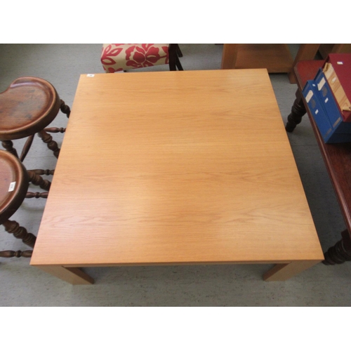 65 - A modern light oak finished coffee table, raised on planked legs  16