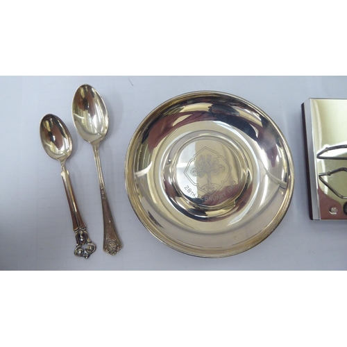 77 - Small silver and silver coloured metal items: to include a pair of napkin rings and a shallow dish&n... 