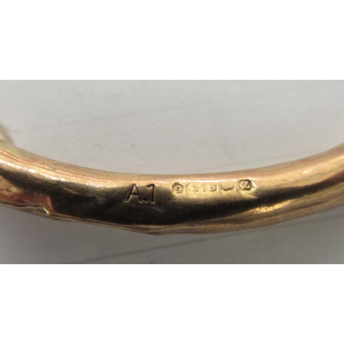 132 - A 9ct gold hollow bangle 