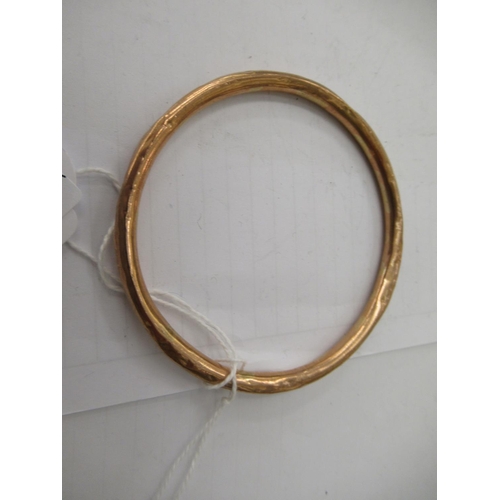 132 - A 9ct gold hollow bangle 