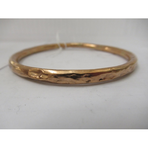 132 - A 9ct gold hollow bangle 