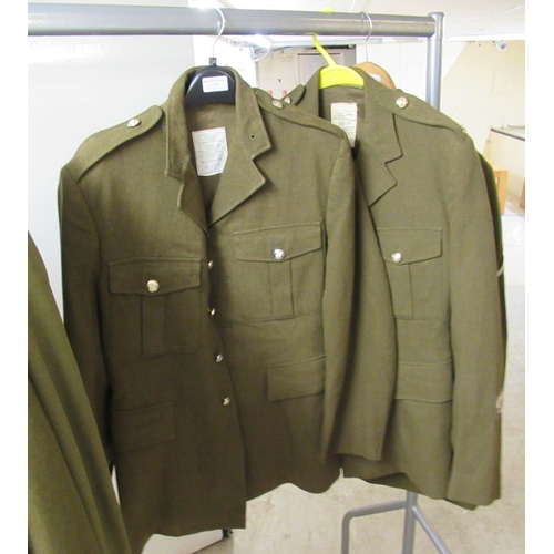 30 - Nine Army dress tunics, some bearing labels, some with matching trousers  various sizes