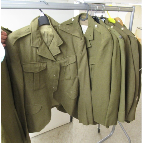 30 - Nine Army dress tunics, some bearing labels, some with matching trousers  various sizes