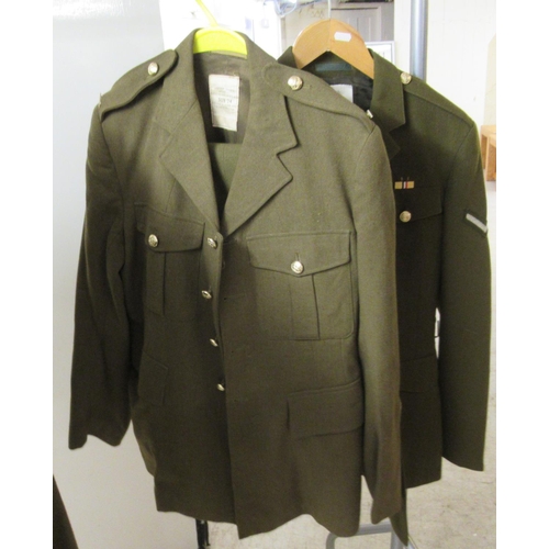 30 - Nine Army dress tunics, some bearing labels, some with matching trousers  various sizes