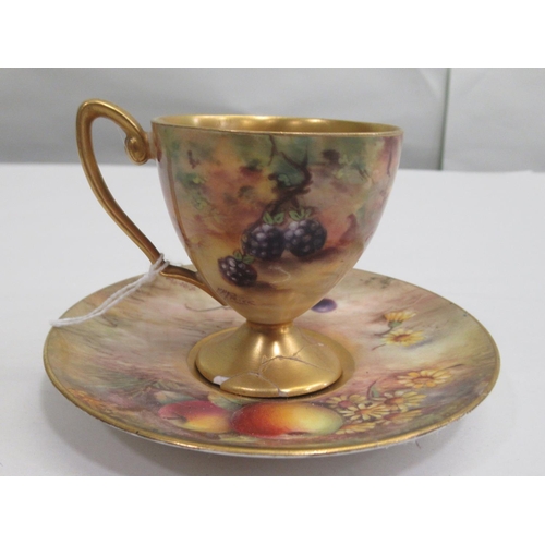 11 - A Royal Worcester china matched pedestal coffee cup and saucer, decorated with soft fruit and gildin... 