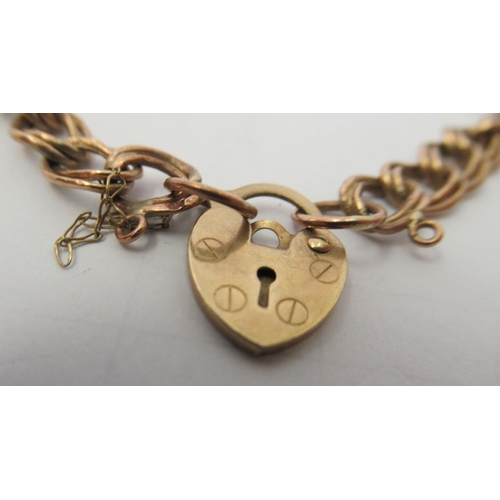 119 - A 9ct gold, double open ring link bracelet, on a padlock clasp