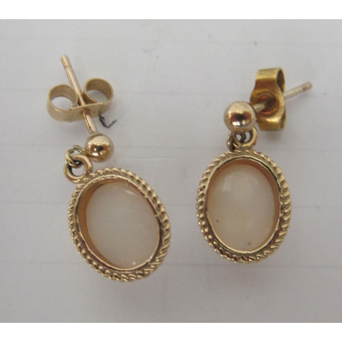 134 - A pair of 9ct gold, opal set drop earrings