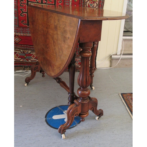 152 - A late Victorian walnut Sutherland table, the quartered and figured oval top, raised on tulip carved... 