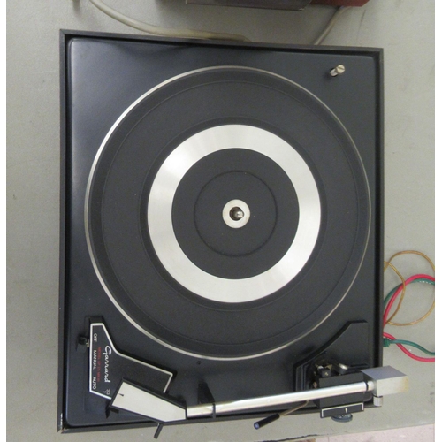 184 - A Garrard record deck, in a teak case; and an Eagle amp, in a teak case