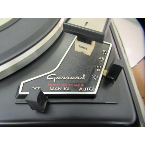 184 - A Garrard record deck, in a teak case; and an Eagle amp, in a teak case