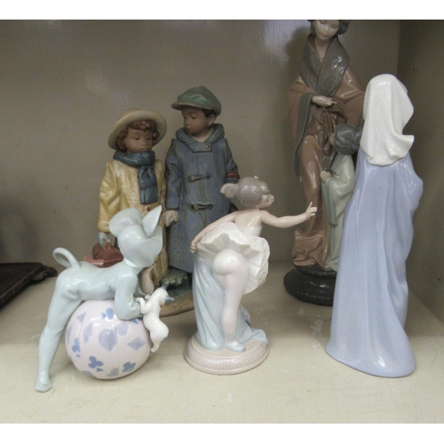 186 - Lladro and Nao porcelain figures: to include a child, dressed in a mouse costume  6