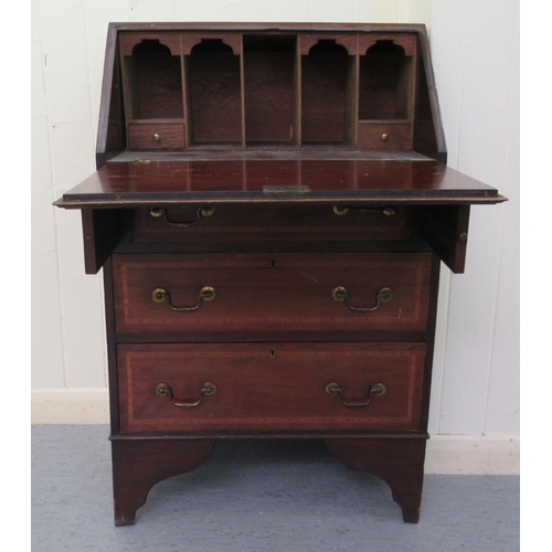 35 - An Edwardian crossbanded string inlaid mahogany bureau bookcase, the fall flap over three long drawe... 