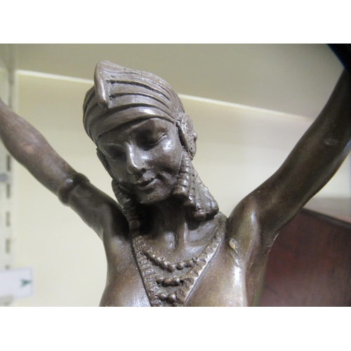 94 - An Art Deco style patinated bronze figure, a female dancer, on a marble and slate effect plinth ... 