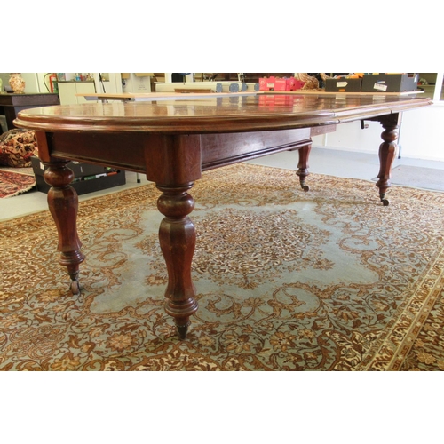 181 - A late Victorian mahogany wind-out dining table, raised on octagonal, fluted legs and casters  29