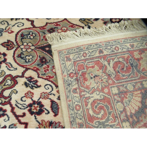306 - A Caucasian rug, decorated with floral and foliate designs, on a cream coloured ground&nbsp; 78