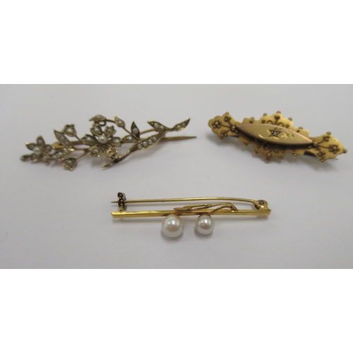 100 - Three dissimilar and variously set 9ct gold seed pearl bar brooches 