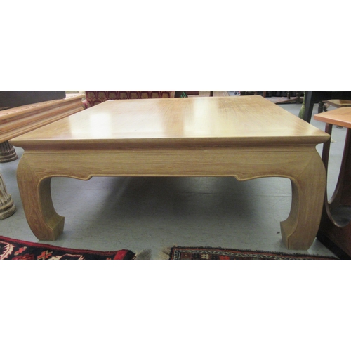 105 - A modern Chinese inspired light oak coffee table, raised on curved legs  16