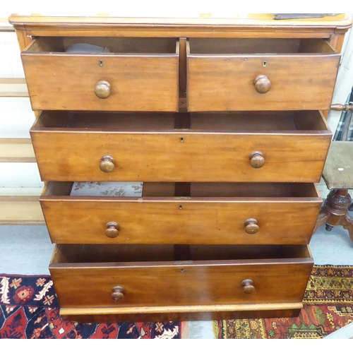 106 - A late Victorian mahogany dressing chest with round corners, comprising two short/three graduated lo... 