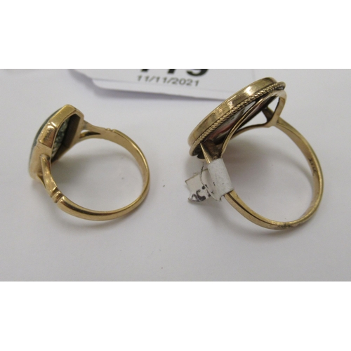 119 - Two dissimilar gold coloured metal and agate set dress rings 