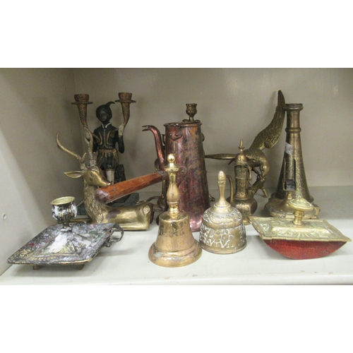 123 - Metalware: to include a cast metal candelabrum, fashioned as an Indian gentleman, holding two torche... 