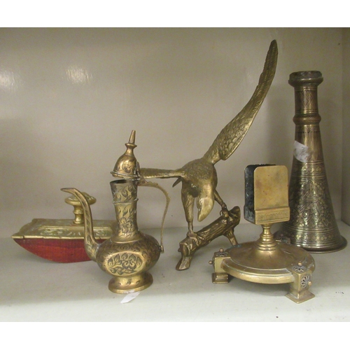 123 - Metalware: to include a cast metal candelabrum, fashioned as an Indian gentleman, holding two torche... 