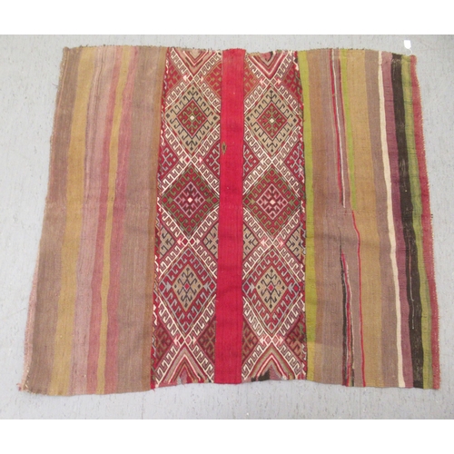 128 - A Kelim flat woven rug, decorated with coloured bands and zig-zag designs  51