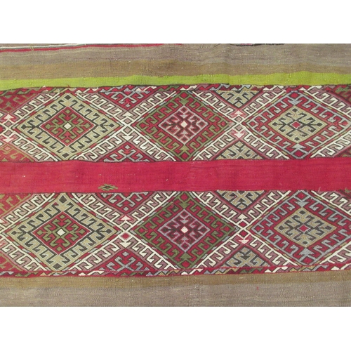 128 - A Kelim flat woven rug, decorated with coloured bands and zig-zag designs  51