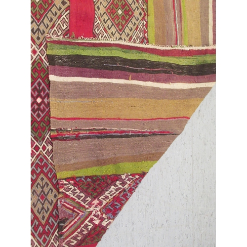 128 - A Kelim flat woven rug, decorated with coloured bands and zig-zag designs  51