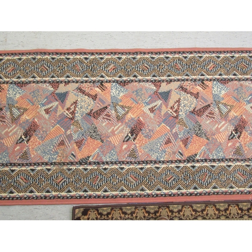 189 - An (off-cut) machine made runner, decorated in 1970s taste on a multi-coloured ground  32