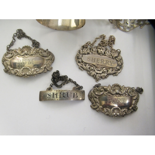 203 - Silver, white metal and other items: to include a 19thC 'Shrub' wine label; a twin handled coaster; ... 