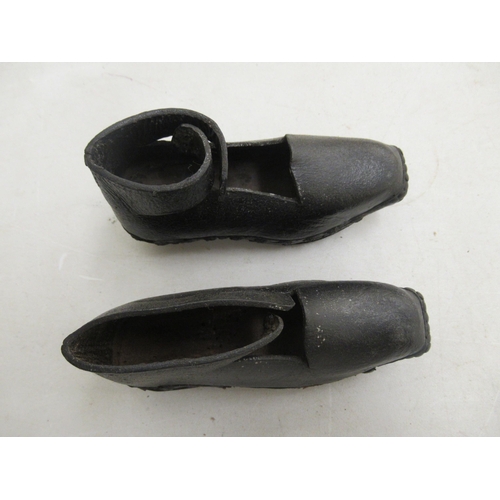 206 - A mixed lot: to include a late 19th/early 20thC pair of childs clogs with wooden soles and black hid... 