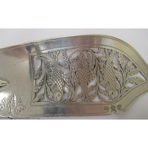 209 - An early Victorian silver fiddle pattern fish slice, the blade pierced, engraved and chased with fis... 