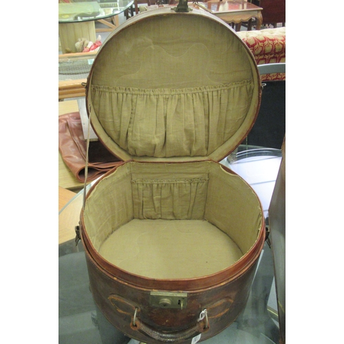 224 - An Edwardian lady's stitched and moulded brown hide stitched and lined hat box; and gentleman's vale... 