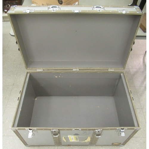 225 - A modern re-enforced and riveted alloy trunk with clasps and flank carrying handles  23