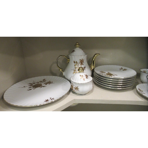 227 - A German ivory glazed and gilded porcelain tea set  comprising twelve place setting including t... 