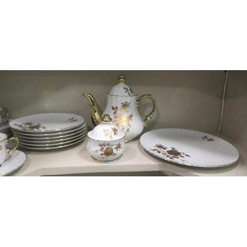 227 - A German ivory glazed and gilded porcelain tea set  comprising twelve place setting including t... 