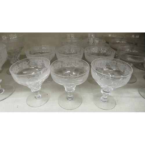 231 - Decorative glassware: to include stemmed, engraved sundae dishes 