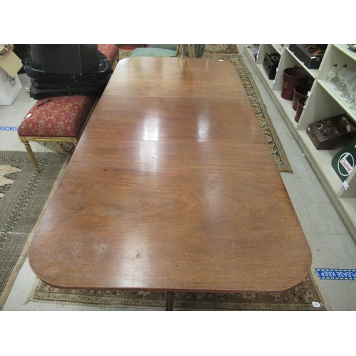 238 - An early 20thC Regency style mahogany dining table, raised on twin pedestals with splayed sabre legs... 