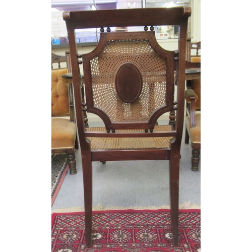 240 - An Edwardian Shoolbred & Co satinwood inlaid mahogany bedroom chairs with a caned seat, raised o... 