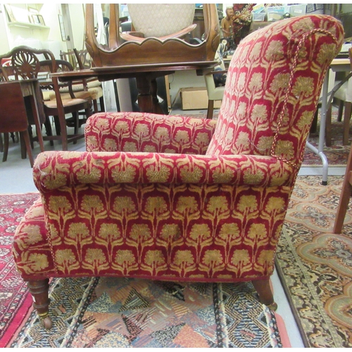 244 - An Edwardian red and gold coloured floral fabric upholstered salon chair, raised on mahogany turned,... 